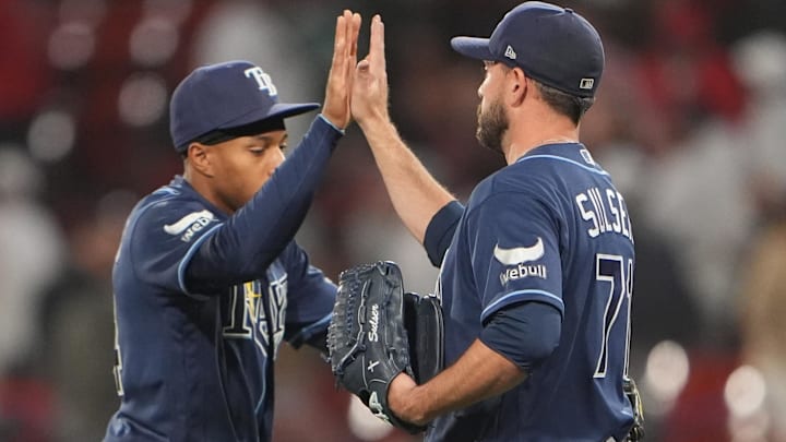 May 7, 2026; Boston, Massachusetts, USA; Tampa Bay Rays left fielder Chandler Simpson (14) and Tampa Bay Rays pitcher Cole Sulser (71) celebrate the victory against the Boston Red Sox after the ninth inning at Fenway Park.