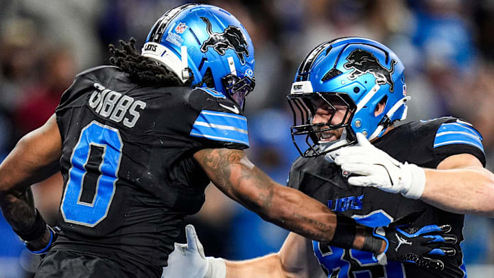 Detroit Lions running back Jahmyr Gibbs (0) celebrates a touchdown against Giants with tight end Brock Wright (89) 