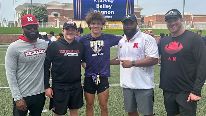 2027 wide receiver Jordan Frohock (center) with several Husker coaches after receiving his scholarship offer in 2024.