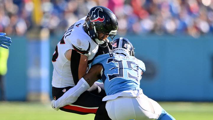 Nov 16, 2025; Nashville, Tennessee, USA; Tennessee Titans cornerback Darrell Baker Jr. (39) tackles Houston Texans tight end Dalton Schultz (86) during the first quarter at Nissan Stadium. Mandatory Credit: Steve Roberts-Imagn Images Nov 16, 2025; Nashville, Tennessee, USA; Tennessee Titans cornerback Darrell Baker Jr. (39) tackles Houston Texans tight end Dalton Schultz (86) during the first quarter at Nissan Stadium. Mandatory Credit: Steve Roberts-Imagn Images
