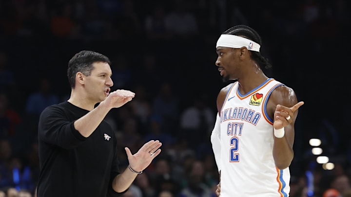 Oct 9, 2024; Oklahoma City, Oklahoma, USA; Oklahoma City Thunder head coach Mark Daigneault talks to guard Shai Gilgeous-Alexander (2) during the first quarter at Paycom Center. Mandatory Credit: Alonzo Adams-Imagn Images