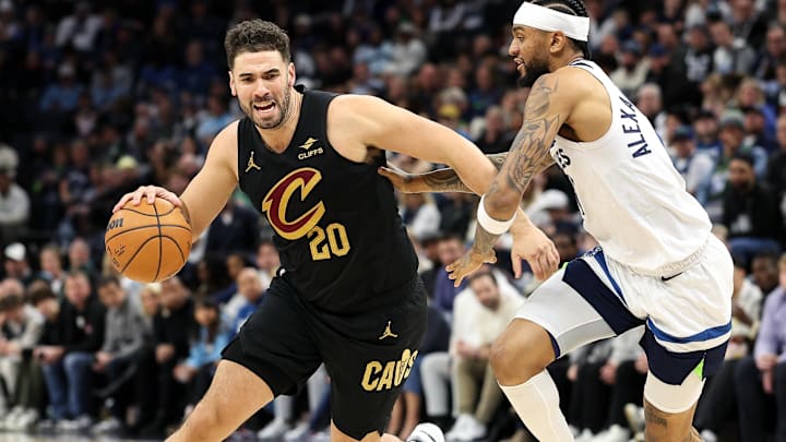 Jan 18, 2025; Minneapolis, Minnesota, USA; Cleveland Cavaliers forward Georges Niang (20) works around Minnesota Timberwolves guard Nickeil Alexander-Walker (9) during the third quarter at Target Center. Mandatory Credit: Matt Krohn-Imagn Images