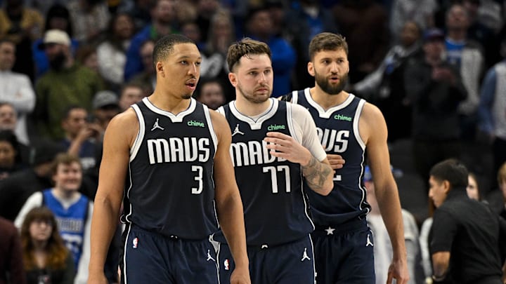 Jan 27, 2024; Dallas, Texas, USA; Dallas Mavericks forward Grant Williams (3) and guard Luka Doncic (77) and forward Maxi Kleber (42) walk back on to the court during the second half against the Sacramento Kings at the American Airlines Center. Mandatory Credit: Jerome Miron-Imagn Images