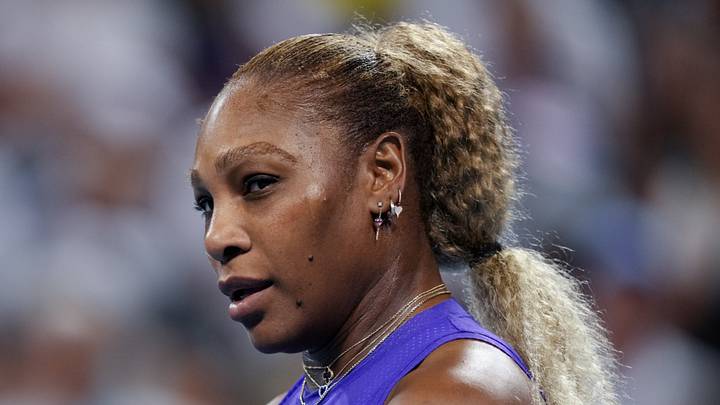 Serena Williams stands on the court