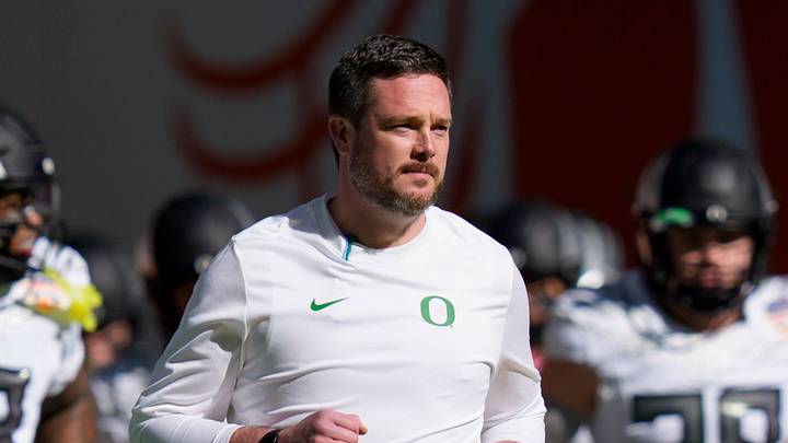 Oregon head coach Dan Lanning takes the field with his team for warmups as the Oregon Ducks take on the Texas Tech Red Raiders in the Orange Bowl on Jan. 1, 2026, at Hard Rock Stadium in Miami, Florida. Oregon head coach Dan Lanning takes the field with his team for warmups as the Oregon Ducks take on the Texas Tech Red Raiders in the Orange Bowl on Jan. 1, 2026, at Hard Rock Stadium in Miami, Florida.