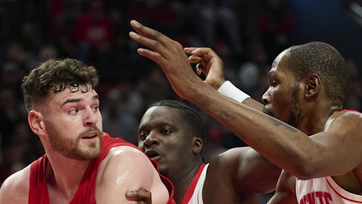 Portland Trail Blazers center Donovan Clingan looks to pass the ball against Houston Rockets center Clint Capela Portland Trail Blazers center Donovan Clingan looks to pass the ball against Houston Rockets center Clint Capela