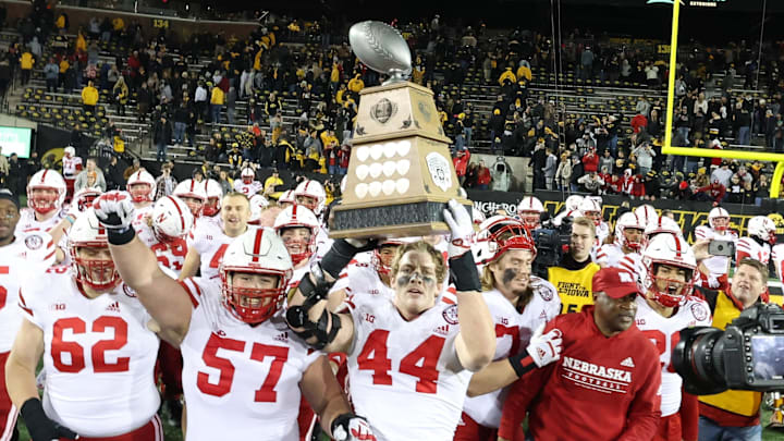 Nov 25, 2022; Iowa City, Iowa, USA; The Nebraska Cornhuskers carry off the Heroes Trophy after defeating the Iowa Hawkeyes at Kinnick Stadium.