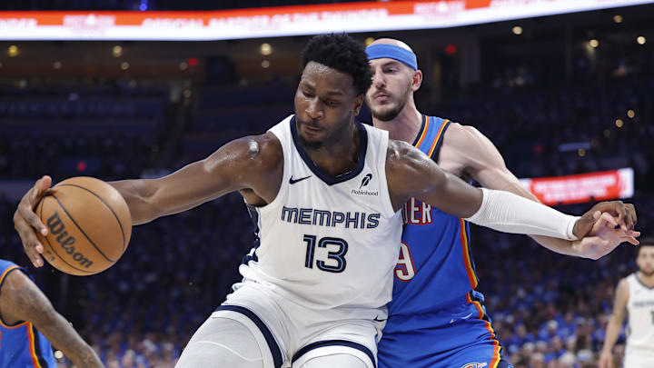 Apr 22, 2025; Oklahoma City, Oklahoma, USA; Memphis Grizzlies forward Jaren Jackson Jr. (13) moves the ball against Oklahoma City Thunder guard Alex Caruso (9) in the third quarter during game two of first round for the 2024 NBA Playoffs at Paycom Center. Mandatory Credit: Alonzo Adams-Imagn Images Apr 22, 2025; Oklahoma City, Oklahoma, USA; Memphis Grizzlies forward Jaren Jackson Jr. (13) moves the ball against Oklahoma City Thunder guard Alex Caruso (9) in the third quarter during game two of first round for the 2024 NBA Playoffs at Paycom Center. Mandatory Credit: Alonzo Adams-Imagn Images