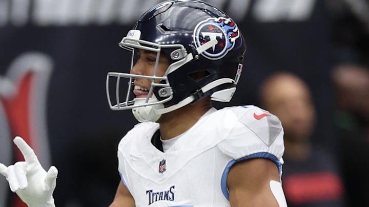 Nov 24, 2024; Houston, Texas, USA;  Tennessee Titans wide receiver Nick Westbrook-Ikhine (15) celebrates his touchdown reception against the Houston Texans in the first quarter at NRG Stadium. Mandatory Credit: Thomas Shea-Imagn Images