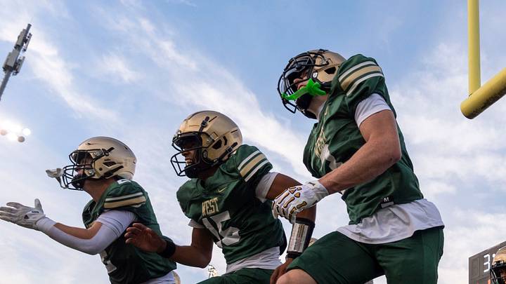 The Iowa City West Trojans take the field Aug. 28, 2026 during an Iowa High School football game at Iowa City West High School in Iowa City, Iowa.