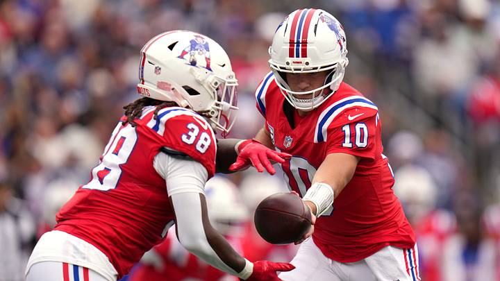 New England Patriots quarterback Drake Maye, right, hands the ball to running back Rhamondre Stevenson. New England Patriots quarterback Drake Maye, right, hands the ball to running back Rhamondre Stevenson.