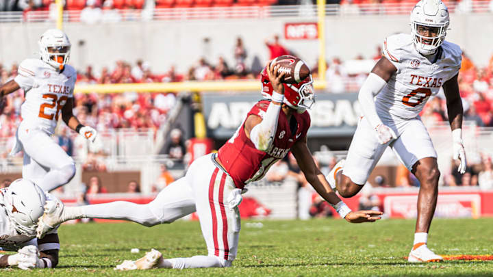 Arkansas Quarterback Taylen Green (10) attempts to throw the ball away against the Texas Longhorns to avoid a sack. The Longhorns won 20-10.