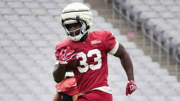 Arizona Cardinals running back Trey Benson (33) practices during training camp at State Farm Stadium in Glendale on July 26, 2026. Arizona Cardinals running back Trey Benson (33) practices during training camp at State Farm Stadium in Glendale on July 26, 2026.