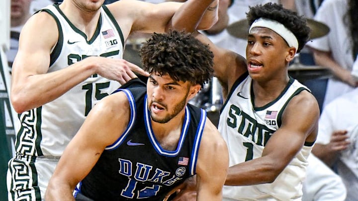 Michigan State's Carson Cooper, left, and Jeremy Fears Jr., right, pressure Duke's Cameron Boozer during the second half on Saturday, Dec. 6, 2025, at the Breslin Center in East Lansing.