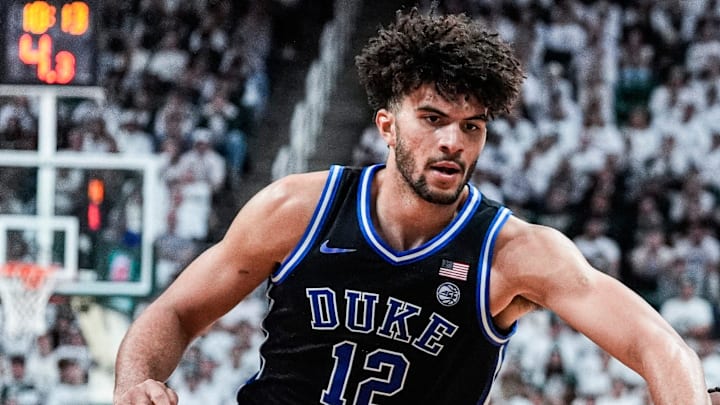 Michigan State guard Kur Teng (2) dribbles against Duke forward Cameron Boozer (12) during the second half at Breslin Center in East Lansing on Saturday, Dec. 6, 2025. Michigan State guard Kur Teng (2) dribbles against Duke forward Cameron Boozer (12) during the second half at Breslin Center in East Lansing on Saturday, Dec. 6, 2025.