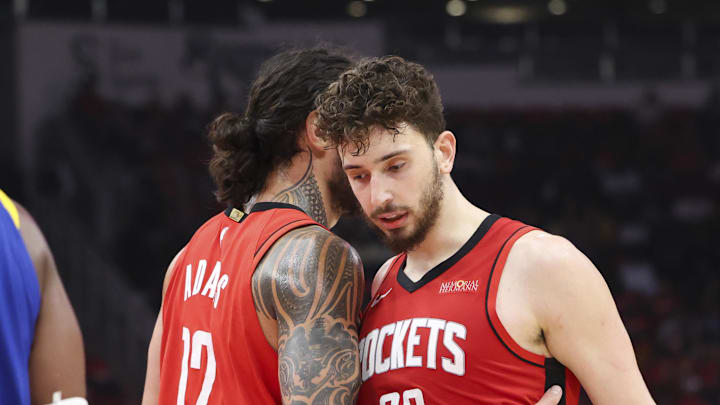 Apr 20, 2025; Houston, Texas, USA; Houston Rockets center Steven Adams (12) talks with center Alperen Sengun (28) after a play during the third quarter against the Golden State Warriors at Toyota Center. Mandatory Credit: Troy Taormina-Imagn Images