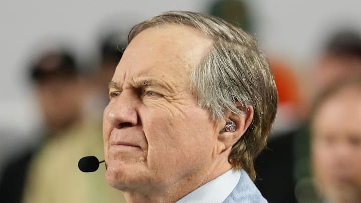 Jan 19, 2026; Miami Gardens, FL, USA; TV analyst Bill Belichick watches the Miami Hurricanes play the Indiana Hoosiers during the first half of the College Football Playoff National Championship game at Hard Rock Stadium. Mandatory Credit: Kirby Lee-Imagn Images Jan 19, 2026; Miami Gardens, FL, USA; TV analyst Bill Belichick watches the Miami Hurricanes play the Indiana Hoosiers during the first half of the College Football Playoff National Championship game at Hard Rock Stadium. Mandatory Credit: Kirby Lee-Imagn Images