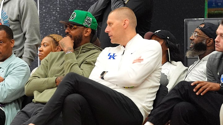 July 19, 2025; North Augusta, South Carolina, USA; NBA star Carmelo Anthony (center right) talks to University of Kentucky basketball coach Mark Pope (right) during the Team Why Not and Team CP3 game at the Nike EYBL Peach Jam at Riverview Park Activity Center. Team Why Not won 66-63. Mandatory Credit: Katie Goodale - Augusta Chronicle/USA TODAY NETWORK