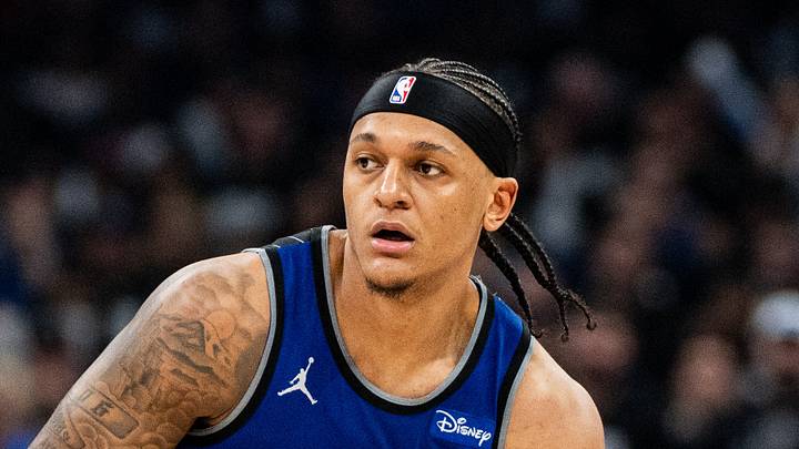 Orlando Magic forward Paolo Banchero dribbles the ball against Detroit Pistons forward Paul Reed. Orlando Magic forward Paolo Banchero dribbles the ball against Detroit Pistons forward Paul Reed.