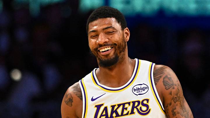 Nov 2, 2025; Los Angeles, California, USA; Los Angeles Lakers guard Austin Reaves (15) reacts with guard Marcus Smart (36) after scoring against the Miami Heat during the first half at Crypto.com Arena. Mandatory Credit: Jonathan Hui-Imagn Images