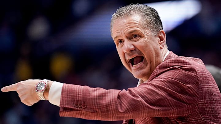 Arkansas coach John Calipari works with his team during the second half of a SEC tournament semifinal game against Ole Miss at Bridgestone Arena in Nashville, Tenn.