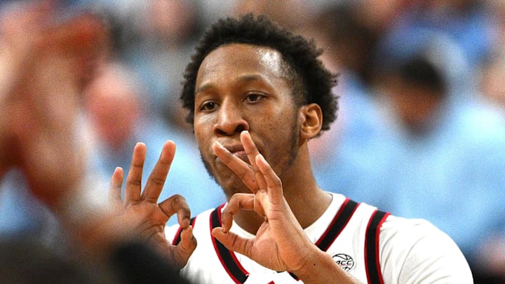 Feb 17, 2026; Raleigh, North Carolina, USA;  NC State Wolfpack guard Quadir Copeland (11) reacts after scoring during the first half against the North Carolina Tar Heels at Lenovo Center. Mandatory Credit: Zachary Taft-Imagn Images