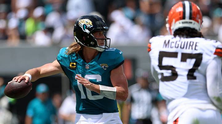 Sep 13, 2026; Jacksonville, Florida, USA;  Jacksonville Jaguars quarterback Trevor Lawrence (16) looks to pass as Cleveland Browns defensive end Isaiah McGuire (57) defends in the second quarter at EverBank Stadium.  Mandatory Credit: Nathan Ray Seebeck-Imagn Images
