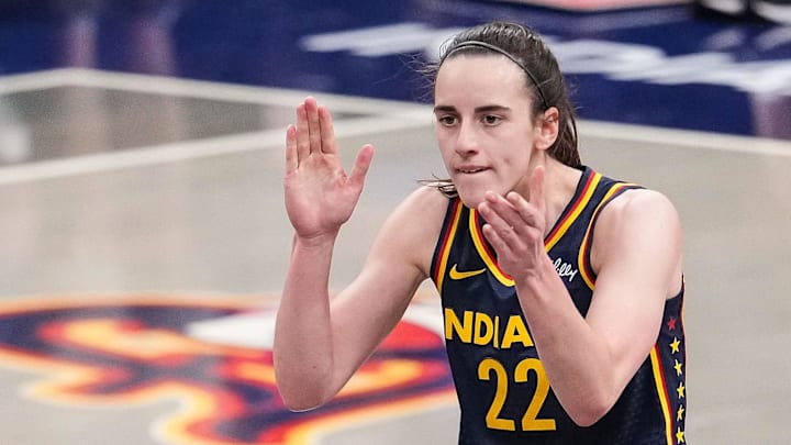 Indiana Fever guard Caitlin Clark (22) claps her hands in excitement Sunday, July 13, 2025, during the game at Gainbridge Fieldhouse in Indianapolis.