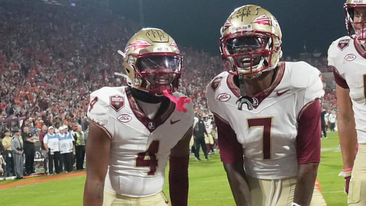 Nov 8, 2025; Clemson, South Carolina, USA; Florida State Seminoles receiver Lawayne McCoy (7) celebrates with teammates after scoring against the Clemson Tigers during the second quarter at Memorial Stadium. Mandatory Credit: Ken Ruinard - GREENVILLE NEWS-USA TODAY Network via Imagn Images