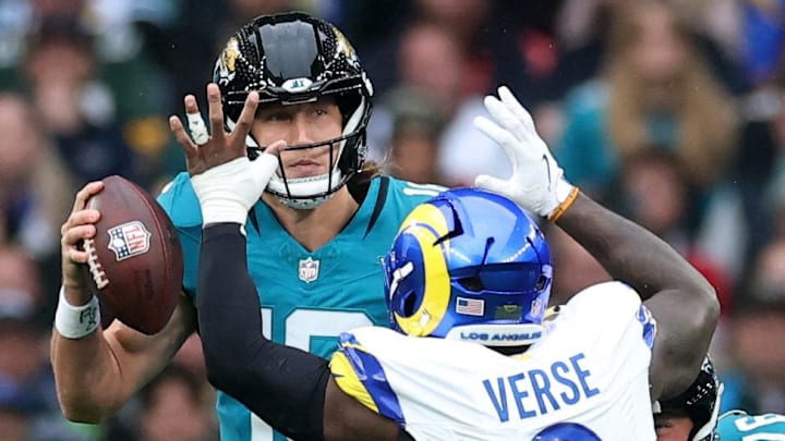 [US, Mexico & Canada customers only] Oct 19, 2025; London, United Kingdom; Los Angeles Rams linebacker Jared Verse (8) defends Jacksonville Jaguars quarterback Trevor Lawrence (16) as Jacksonville Jaguars guard Ezra Cleveland (76) blocks during the first half during a NFL International Series game at Wembley Stadium. Mandatory Credit: Andrew Boyers-Reuters via Imagn Images