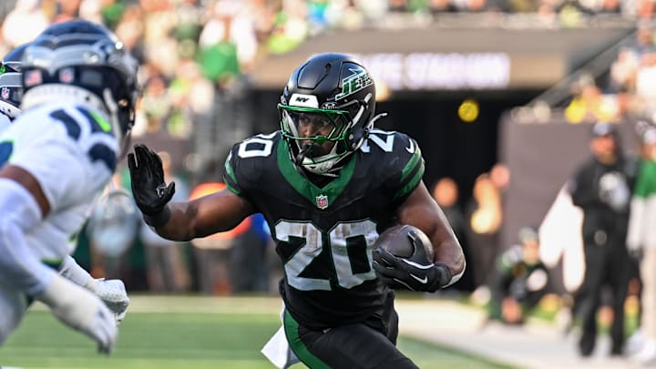 Dec 1, 2024; East Rutherford, New Jersey, USA; New York Jets running back Breece Hall (20) runs with the ball during the second quarter against the Seattle Seahawks at MetLife Stadium. Mandatory Credit: Mark Smith-Imagn Images