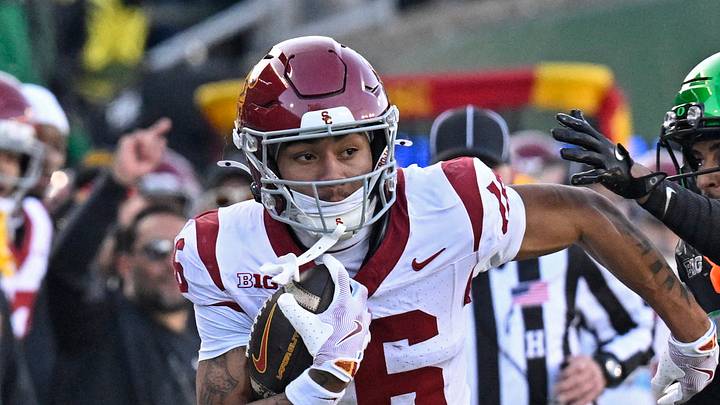 Nov 22, 2025; Eugene, Oregon, USA; Southern California Trojans wide receiver Tanook Hines (16) runs with the ball during the first half against the Oregon Ducks at Autzen Stadium. Mandatory Credit: Troy Wayrynen-Imagn Images Nov 22, 2025; Eugene, Oregon, USA; Southern California Trojans wide receiver Tanook Hines (16) runs with the ball during the first half against the Oregon Ducks at Autzen Stadium. Mandatory Credit: Troy Wayrynen-Imagn Images