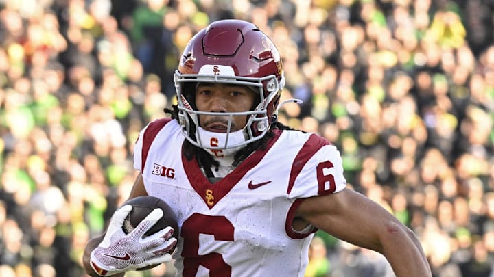 Nov 22, 2025; Eugene, Oregon, USA; Southern California Trojans wide receiver Makai Lemon (6) runs with the ball during the first half against the Oregon Ducks at Autzen Stadium. Mandatory Credit: Troy Wayrynen-Imagn Images Nov 22, 2025; Eugene, Oregon, USA; Southern California Trojans wide receiver Makai Lemon (6) runs with the ball during the first half against the Oregon Ducks at Autzen Stadium. Mandatory Credit: Troy Wayrynen-Imagn Images
