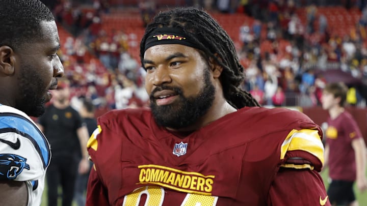 Oct 20, 2024; Landover, Maryland, USA; Carolina Panthers cornerback Shemar Bartholomew (27) talks with Washington Commanders defensive tackle Sheldon Day (64) after their game at Northwest Stadium. Mandatory Credit: Geoff Burke-Imagn Images