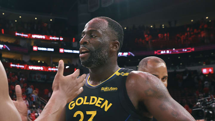 May 4, 2025; Houston, Texas, USA; Golden State Warriors forward Draymond Green (23) greets Houston Rockets forward Amen Thompson (1) after game seven of the first round for the 2025 NBA Playoffs at Toyota Center. Mandatory Credit: Troy Taormina-Imagn Images