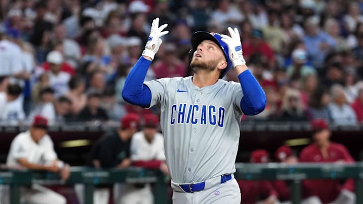 Apr 15, 2024; Phoenix, Arizona, USA; Chicago Cubs first baseman Michael Busch celebrates after hitting a home run