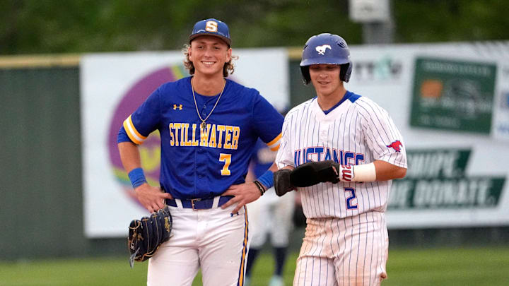 Fort Cobb-Broxton's Eli Willits talks with Stillwater's Ethan Holliday during the high school baseball game between Fort Cobb-Broxton and Stillwater at Edmond Santa Fe High School in Edmond, Okla., Friday, April, 18, 2025.
