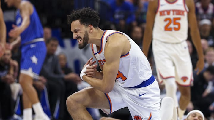 Nov 22, 2025; Orlando, Florida, USA; New York Knicks guard Landry Shamet (44) reacts after an injury against the Orlando Magic in the first quarter at Kia Center. Mandatory Credit: Nathan Ray Seebeck-Imagn Images