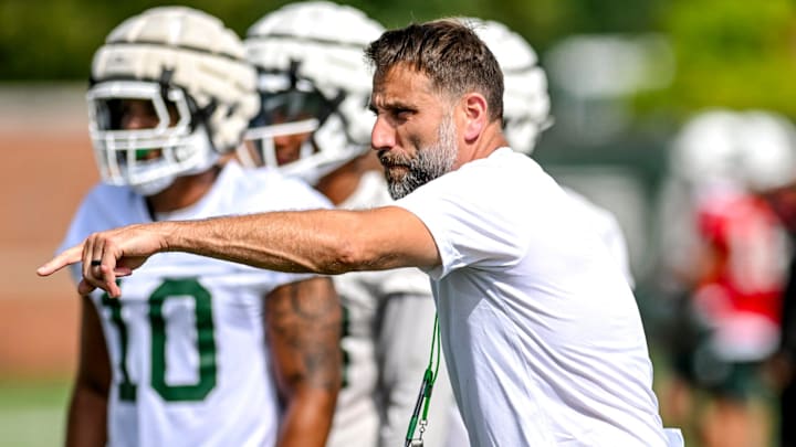 Michigan State's defensive coordinator Joe Rossi works with the defense during the first day of football camp on Tuesday, July 30, 2024, in East Lansing. Michigan State's defensive coordinator Joe Rossi works with the defense during the first day of football camp on Tuesday, July 30, 2024, in East Lansing.