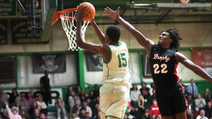 St. Mary's Knights Cameron Williams (15) dunks the ball over Brophy Prep Broncos guard Daylen Sharper (22) at St. Mary's High School gym on Jan. 3, 2024.
