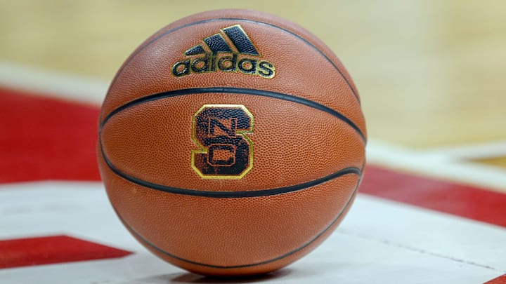 Feb 20, 2019; Raleigh, NC, USA; Basketball with the North Carolina State Wolfpack logo sits on the court during a timeout as the Wolfpack play the Boston College Eagles in the first half at PNC Arena. The North Carolina State Wolfpack won 89-80. Mandatory Credit: Nell Redmond-Imagn Images