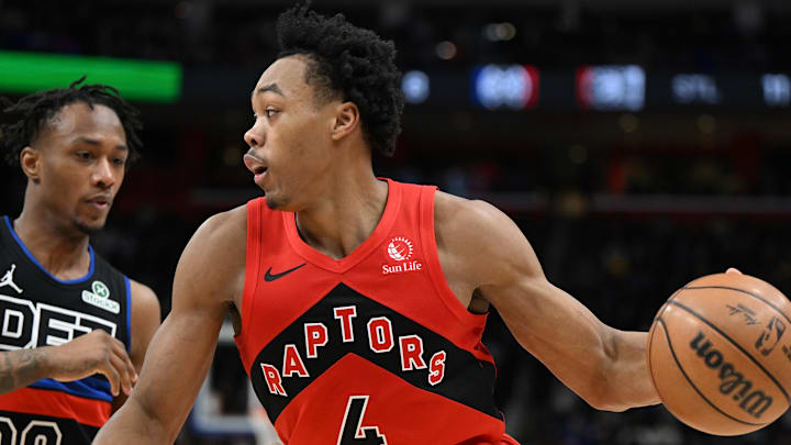 Jan 11, 2025; Detroit, Michigan, USA;  Toronto Raptors forward Scottie Barnes (4) tries to drive past Detroit Pistons forward Ronald Holland II (00) in the fourth quarter at Little Caesars Arena. Mandatory Credit: Lon Horwedel-Imagn Images