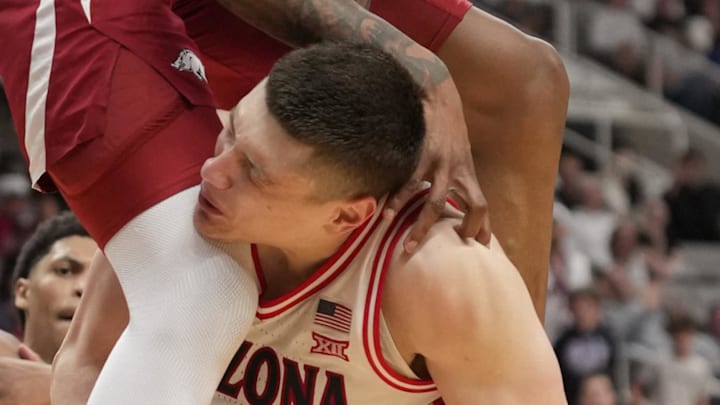 Mar 26, 2026; San Jose, CA, USA; Arkansas Razorbacks forward Nick Pringle (23) fouls Arizona Wildcats forward Ivan Kharchenkov (8) in the second half during a Sweet Sixteen game of the West Regional of the men's 2026 NCAA Tournament at SAP Center. Mandatory Credit: Kyle Terada-Imagn Images