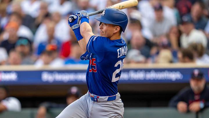 Jun 22, 2026; Minneapolis, Minnesota, USA; Los Angeles Dodgers second baseman Tommy Edman (25) hits single against the Minnesota Twins in the fourth inning at Target Field. Mandatory Credit: Jesse Johnson-Imagn Images