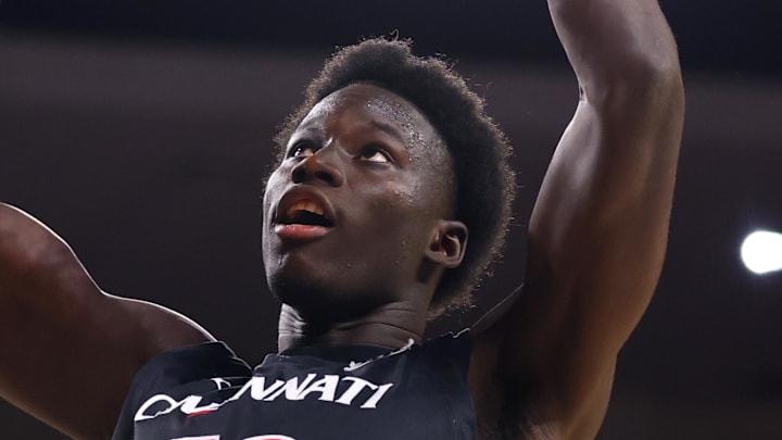 Jan 24, 2026; Tempe, Arizona, USA; Cincinnati Bearcats center Moustapha Thiam (52) dunks the ball against the Arizona State Sun Devils in the first half at Desert Financial Arena.