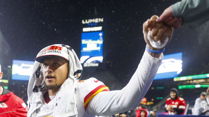 Aug 15, 2025; Seattle, Washington, USA; Kansas City Chiefs quarterback Patrick Mahomes (15) bumps fists with a fan following a loss against the Seattle Seahawks at Lumen Field. Mandatory Credit: Joe Nicholson-Imagn Images