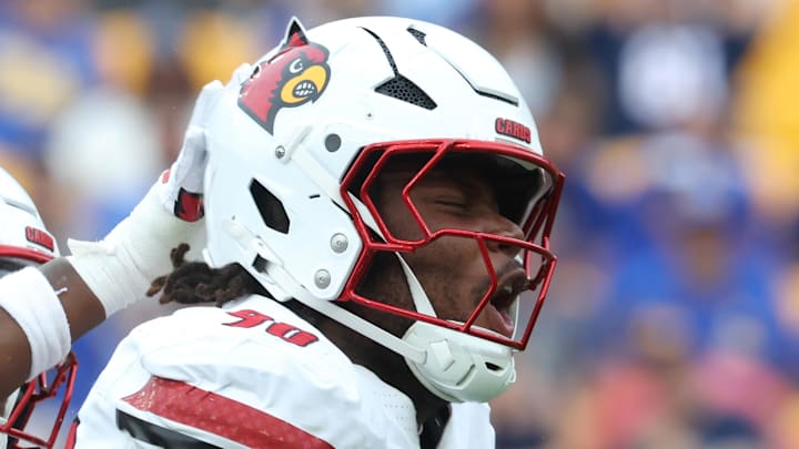 Sep 27, 2025; Pittsburgh, Pennsylvania, USA;  Louisville Cardinals defensive lineman Rene Konga (90) celebrates his sack with defensive lineman Jerry Lawson (left) against the Pittsburgh Panthers during the fourth quarter at Acrisure Stadium. Mandatory Credit: Charles LeClaire-Imagn Images