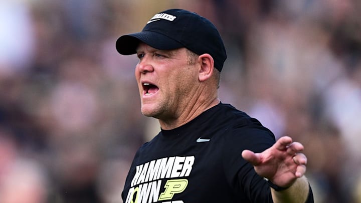 Purdue Boilermakers head coach Barry Odom talks with a linesman 