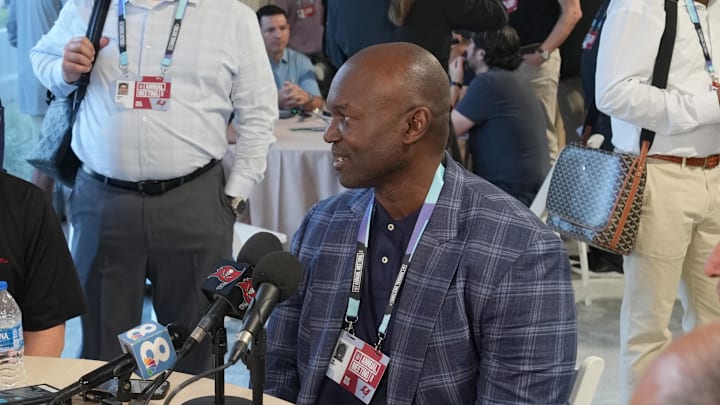 Tampa Buccaneers head coach Todd Bowles, center, answers questions from the media.