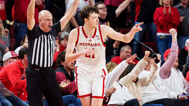 Feb 14, 2026; Lincoln, Nebraska, USA; Nebraska Cornhuskers forward Pryce Sandfort (21) points after a three point shot against the Northwestern Wildcats during the second half at Pinnacle Bank Arena.